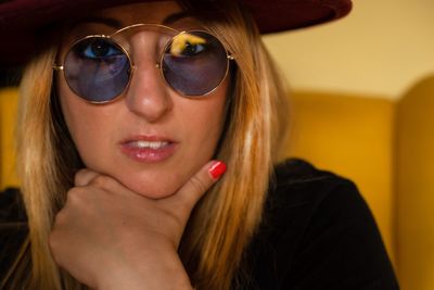 Portrait of beautiful young woman wearing sunglasses