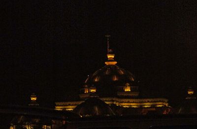 Illuminated cathedral against sky at night