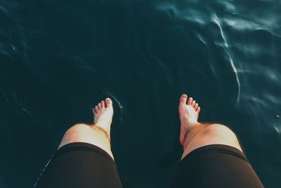 Low section of woman in water