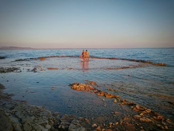 Scenic view of sea at sunset