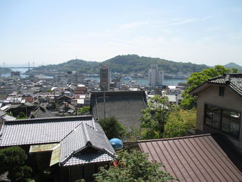 Houses against sky in city