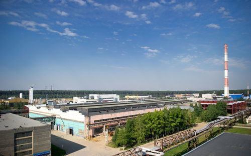 Metallurgical plant against blue sky on sunny day