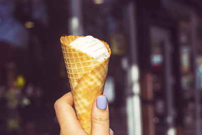 Hand holding ice cream cone