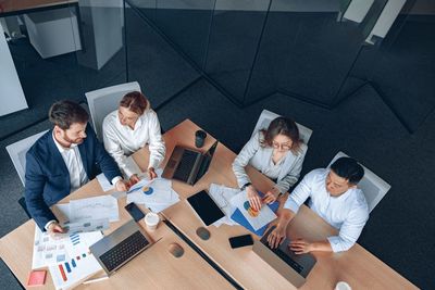 High angle view of business colleagues working in office