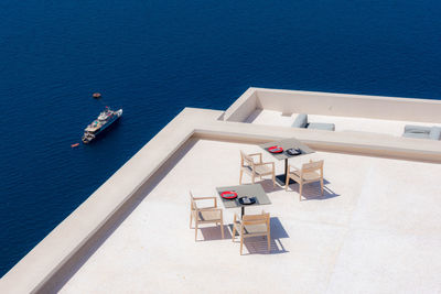 High angle view of ship in sea against blue sky