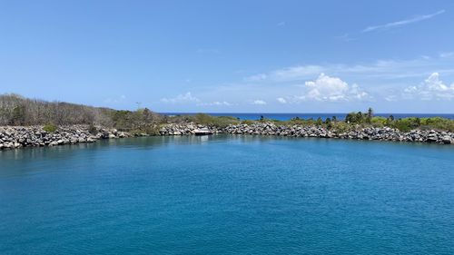 Scenic view of sea against blue sky