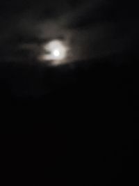 Low angle view of moon in sky at night