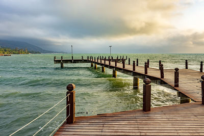 Pier over sea against sky