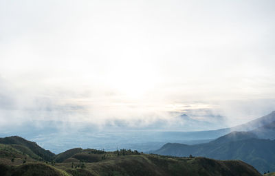 The view from the top of mount prau and the activities of the climbers near the camping tent