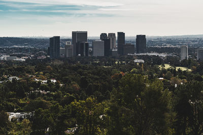 View of modern buildings in city against sky