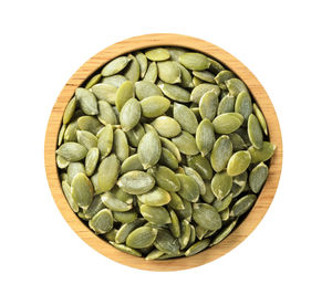 High angle view of green beans in bowl against white background