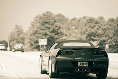 Close-up of car on road