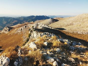 Scenic view of landscape and mountains against sky