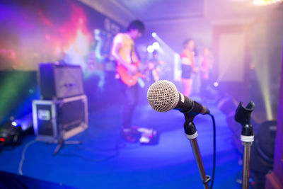 People performing on stage at music concert