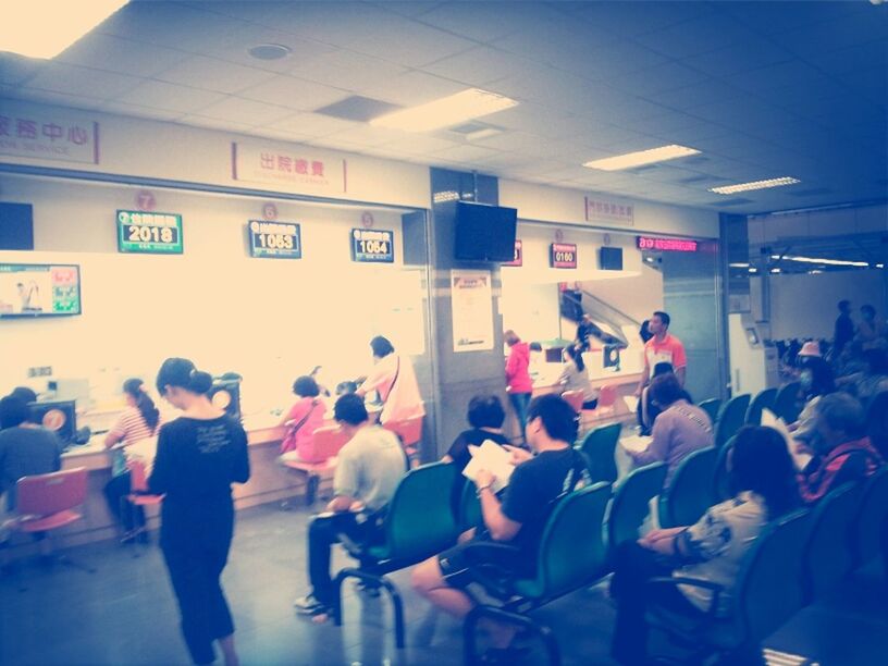 large group of people, men, indoors, lifestyles, person, leisure activity, crowd, public transportation, railroad station, illuminated, airport, city life, communication, passenger, standing, walking, rail transportation, travel, built structure