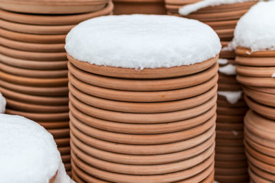 Earthenware flowerpots outdoors in snow winter