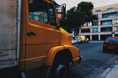 View of yellow car on street