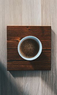 High angle view of coffee cup on table
