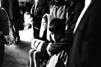 Boy sitting outdoors