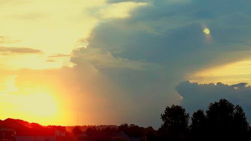 Scenic view of silhouette mountains against sky at sunset