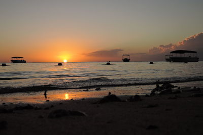 Scenic view of sea at sunset