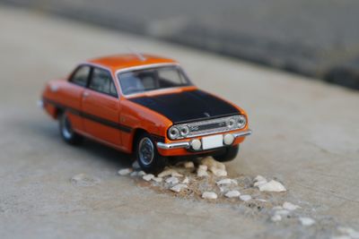 Tilt-shift image of car on road