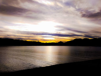 Scenic view of beach against sky during sunset