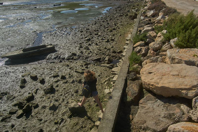 High angle view of woman standing on beach