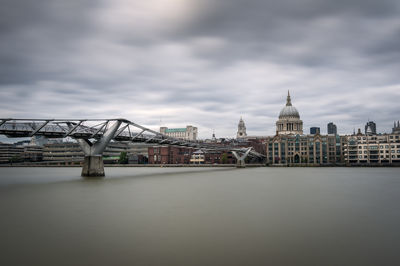 Millenium bridge over the river thames and st. paul's cathedral in london