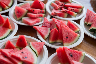 High angle view of chopped fruits in plate on table