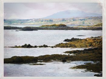 Scenic view of sea and mountains