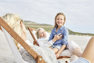 Mother daughter and grandmother spending a day at the beach