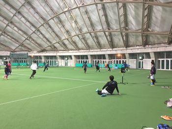 Players practicing football in stadium