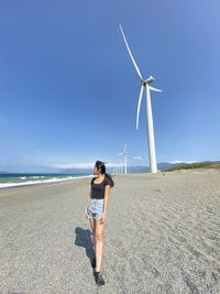 Low section of woman standing on pier