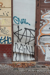 Close-up of graffiti on brick wall