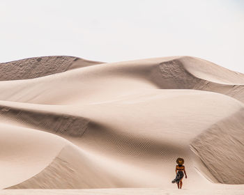 Scenic view of desert against clear sky