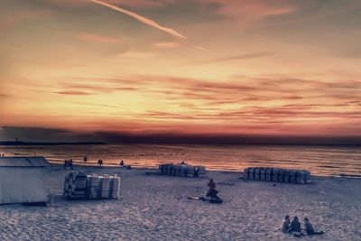 Scenic view of beach against sky during sunset