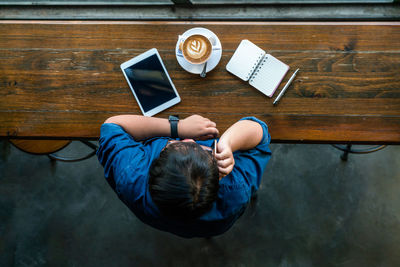 High angle view of man using mobile phone