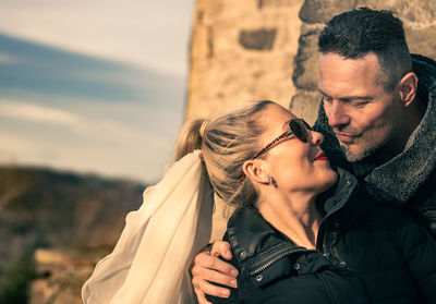 Couple kissing outdoors