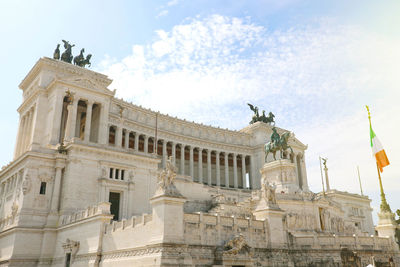 Low angle view of historical building against cloudy sky