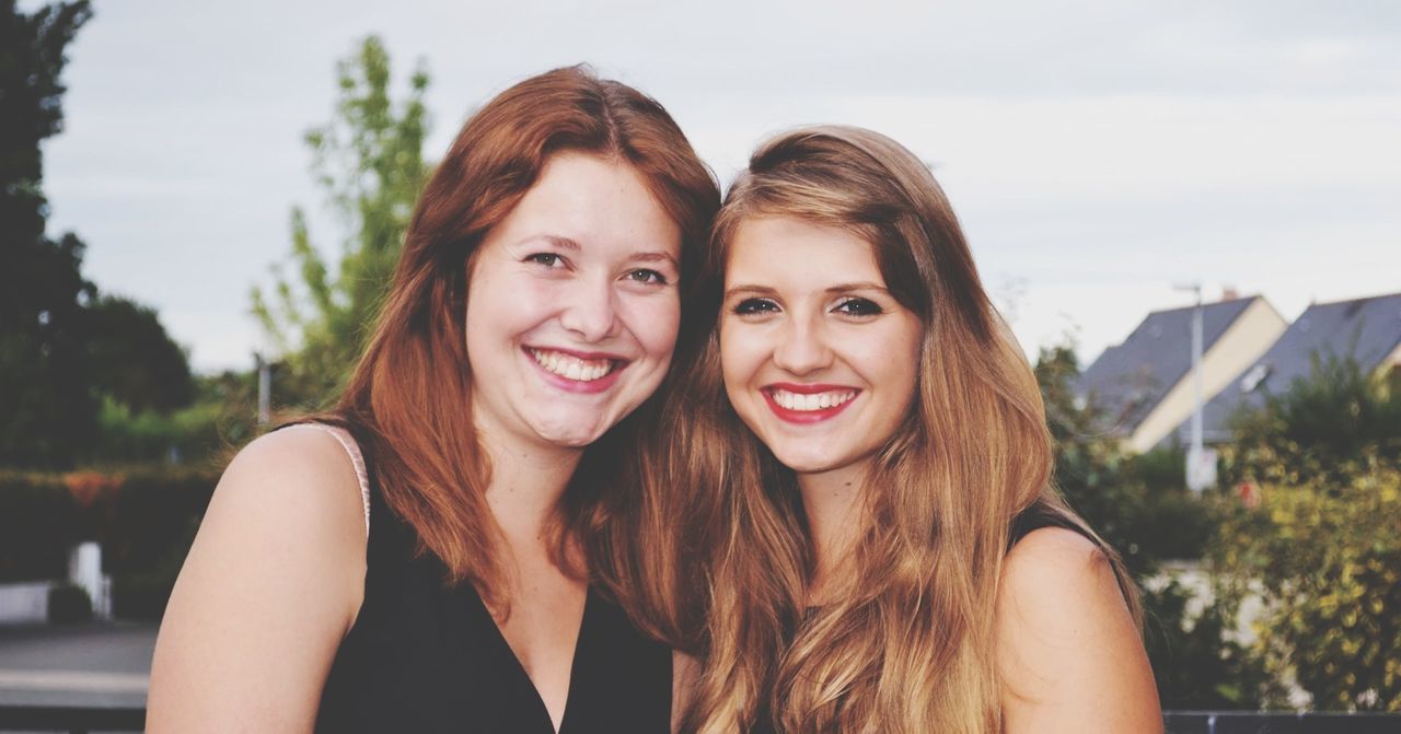 young adult, young women, person, looking at camera, portrait, lifestyles, smiling, long hair, leisure activity, front view, happiness, headshot, toothy smile, casual clothing, brown hair, focus on foreground, head and shoulders