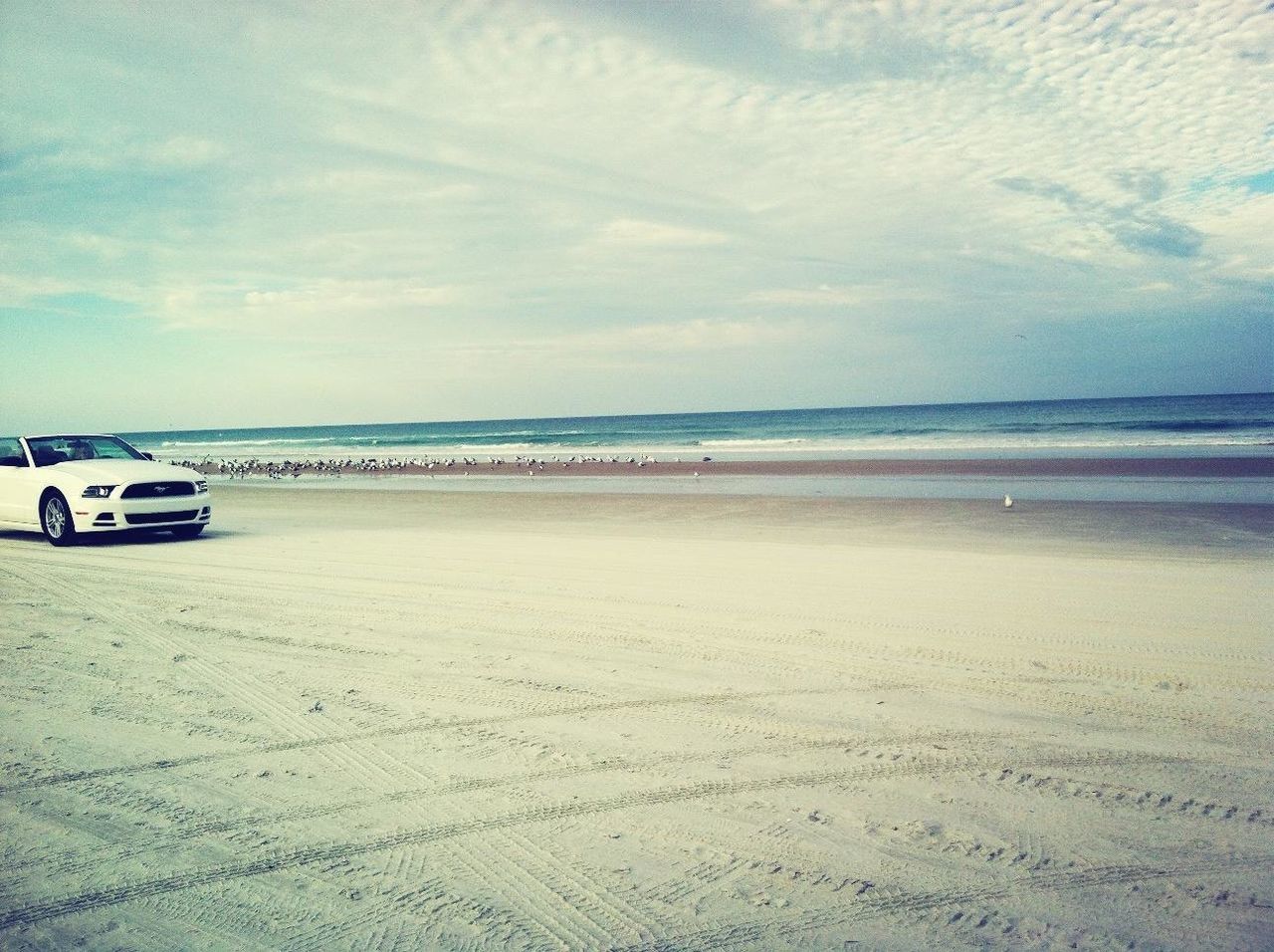 beach, sea, sky, sand, water, shore, transportation, horizon over water, cloud - sky, tranquility, tranquil scene, scenics, mode of transport, nature, beauty in nature, cloud, cloudy, incidental people, day, nautical vessel