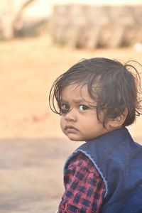 Portrait of cute boy looking away