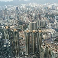 High angle view of cityscape against cloudy sky