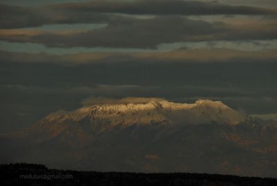 Scenic view of mountains against sky during sunset