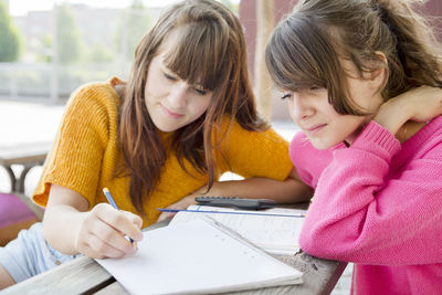 Teenage girls studying, sweden