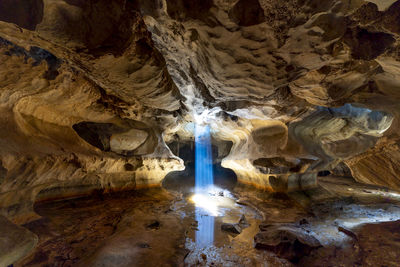 Low angle view of illuminated cave