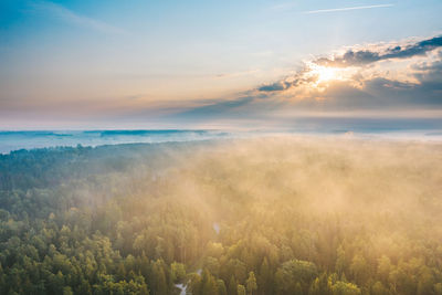 Scenic view of land against sky during sunset