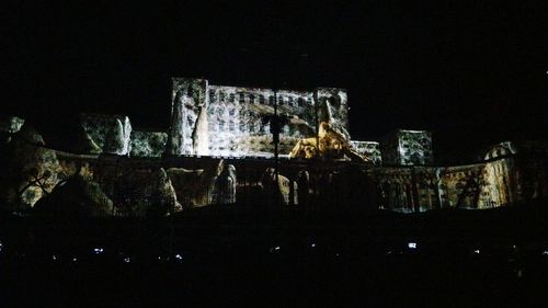 Buildings in city at night