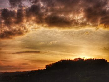 Scenic view of dramatic sky during sunset